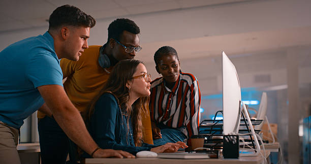 istock Team of Diverse Professionals Collaborating at a Desk in a Modern Office Setting 2218732544