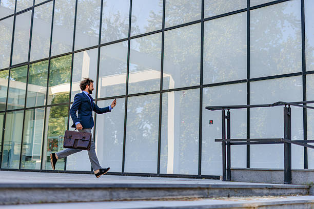 istock Businessman in Motion Checking Phone While Rushing to Work 2218732707