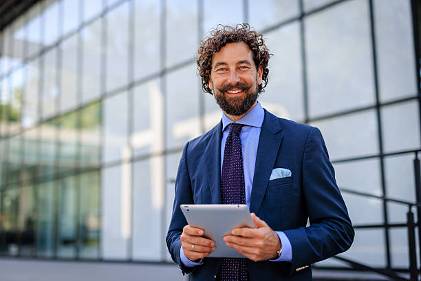 istock Portrait Of Smiling Entrepreneur Embracing Digital Technology 2218732803