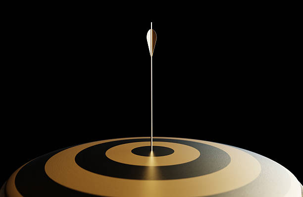 istock Gold Colored Arrow And Dart Object On Black Background 2218732829