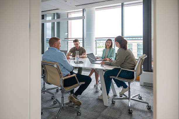 istock Caucasian Business Team Collaborating in Modern Office Meeting 2218732903