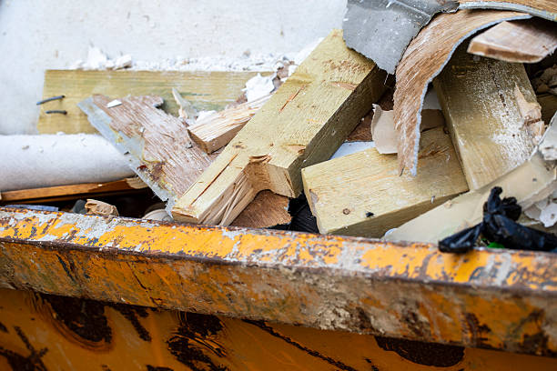 Yellow skip filled with building waste from renovation work