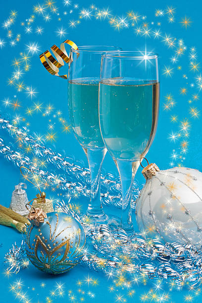 A glass with a foamy yellow and green cocktail on a white background, foam in a glass