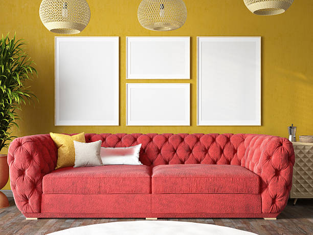 istock Modern Red Sofa in Stylish Yellow Living Room with Empty Picture Frames 2218739341