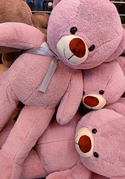 istock soft, plush pink teddy bears piled together inside store showcasing adorable stuffed animals. 2218739474