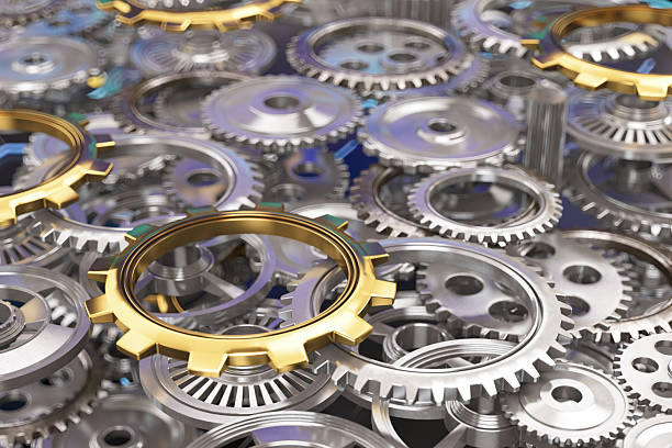 Metallic Gears and Golden Cog Symbolizing Industry Power. 3D Render