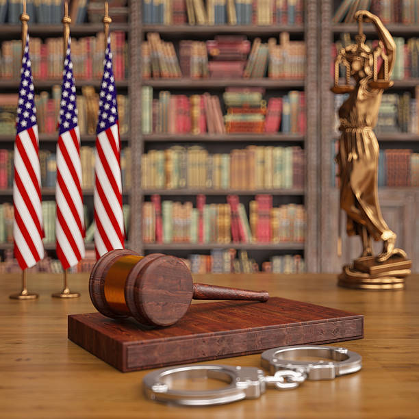 American Justice System Concept With Gavel And Handcuffs. 3D Render