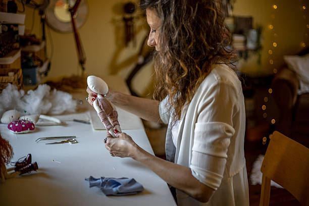 istock A female designer and artisan creating unique handmade dolls from scratch in her creative studio 2218741597