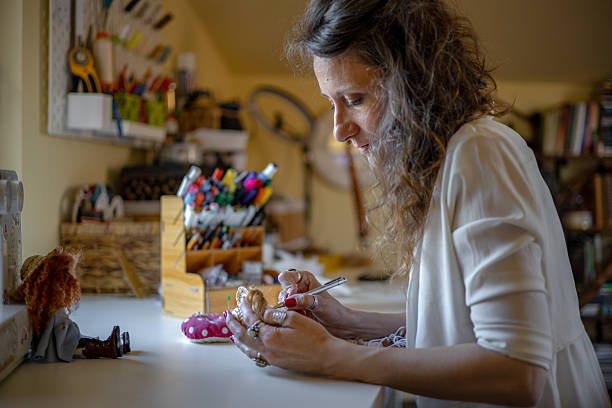 istock A female designer and artisan creating unique handmade dolls from scratch in her creative studio 2218741654