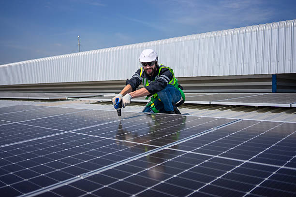 istock Blue collar worker is inspecting solar panel at rooftop of factory. 2218741713