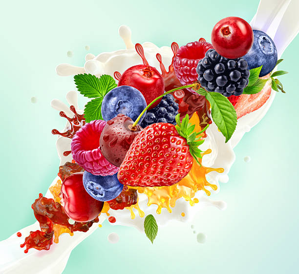 istock Assorted berries and fruits with vibrant juice and milk splashes on a light background 2218743538