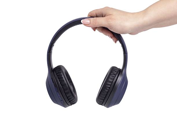 istock blue wireless headphones in hand 2218745918