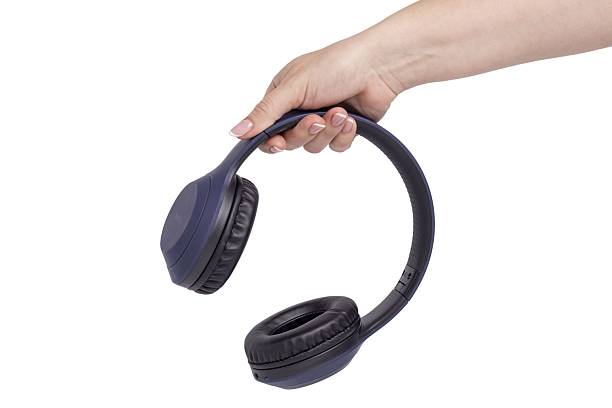 istock blue wireless headphones in hand 2218745925