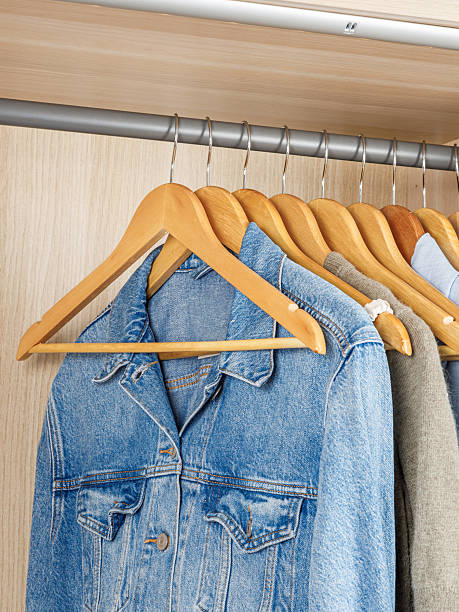 istock A closet that is filled with various clothes including a denim jacket 2218746988