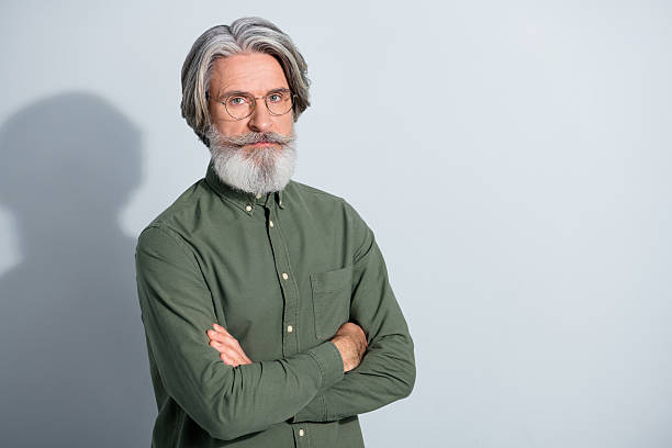 istock Portrait of attractive content grey-haired man expert agent copy space folded arms isolated over gray pastel color background 2218748551