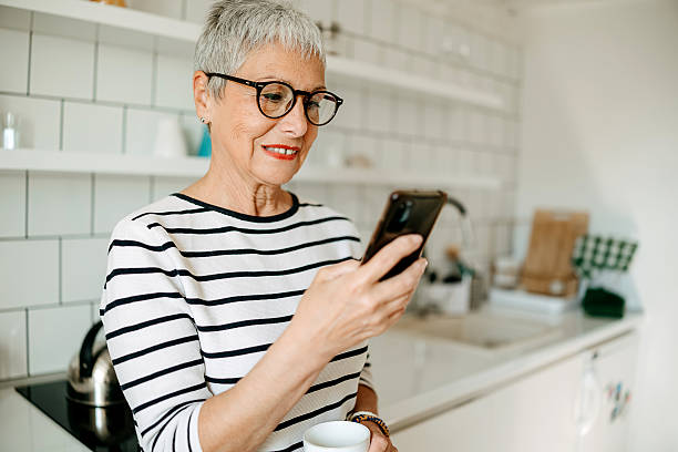 istock An elderly woman uses a mobile phone at home 2218751334