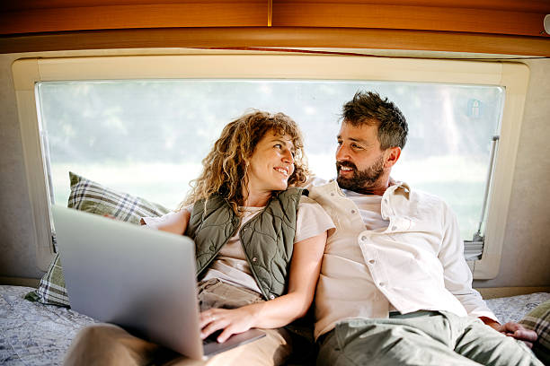 istock Couple camping in a van 2218751705