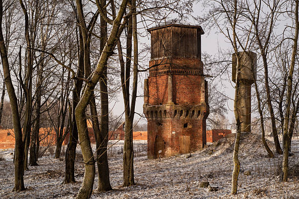 istock Old brick tower in the park in snowy winter. 2218752542