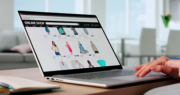 istock Young Woman Purchasing Clothes Online Using Credit Card Payment App 2218755755