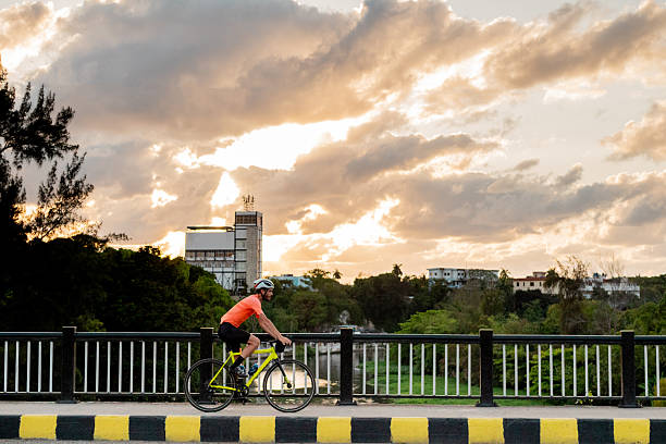 Young cyclist man riding bicycle outdoors
