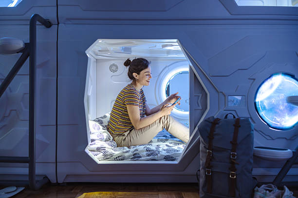 istock Relaxing in a modern capsule hotel pod with blue ambient lighting 2218757582