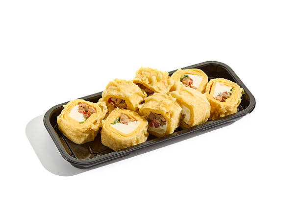 istock Tamago sushi roll on black tray, bright lighting, minimal composition 2218757939
