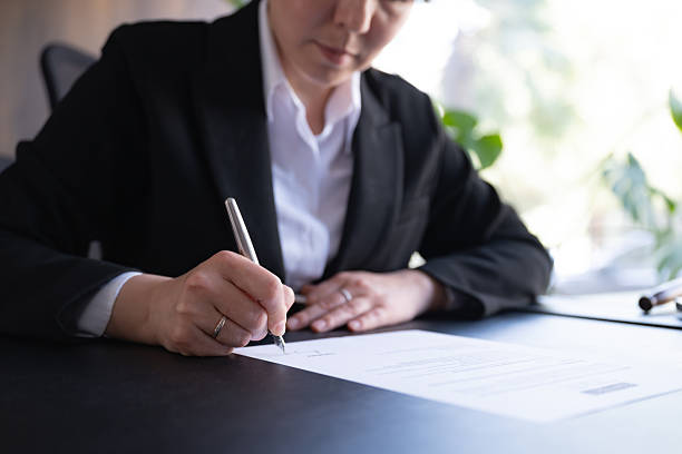 istock Lawyer signing official document 2218760252