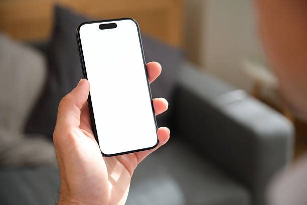 istock Man holding smartphone with blank white screen indoors 2218761211