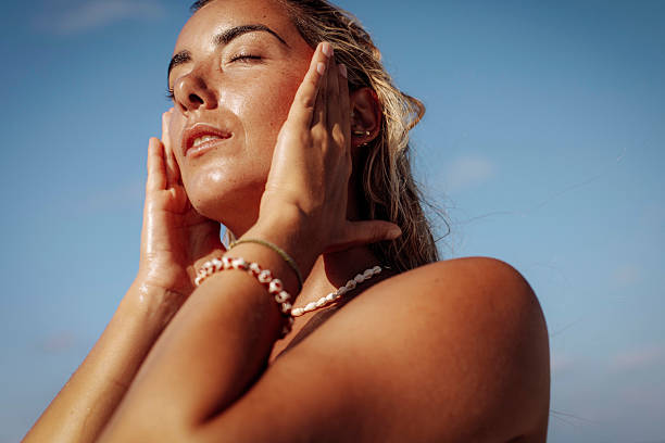 Relaxed Woman Enjoying Sunlight on Beach