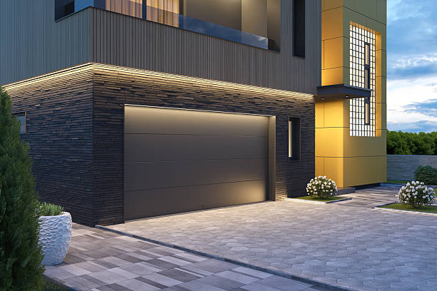 istock Modern Double Garage Entrance with Dark Sectional Roll-Up Doors 2218763655