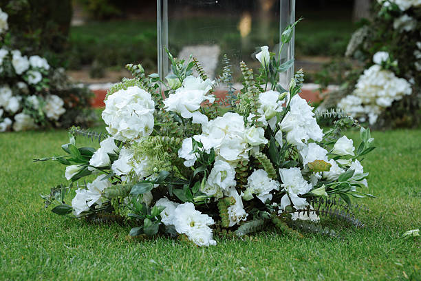 Romantic wedding ceremony. Beautiful setting for outdoors wedding ceremony waiting for bride and groom and guests. Decoration