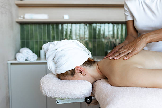 istock Professional back massage therapy in a peaceful spa setting with expert hands 2218765366