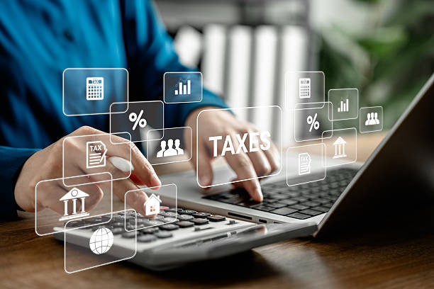 istock Businesswoman analyzing virtual tax data on laptop computer, modern financial technology with digital tax calculation, accounting system, and virtual finance management for business and investment. 2218767608