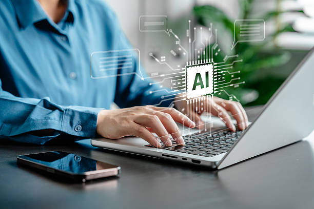 istock Businesswoman working with artificial intelligence system on laptop. AI technology and machine learning concept for digital business, innovation, virtual assistant and modern communication interface. 2218767742