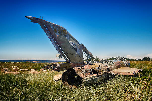 istock war plane crashed on shore of sea several years ago and lies on dunes 2218768058