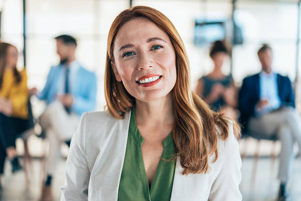 istock Confident businesswoman and her team 2218769428