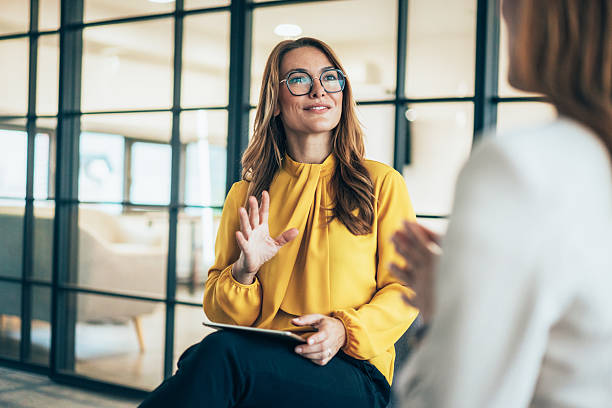 istock Two business coworkers talking 2218769443