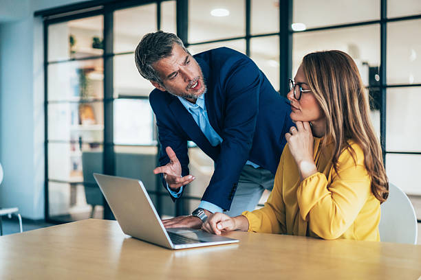 istock Two business coworkers talking 2218769452