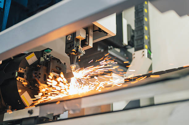 istock Ai-driven automated laser cutter industrial laser cutting machine with robotic automation slicing metal pipe in advanced manufacturing smart industrial production line factory 2218769641