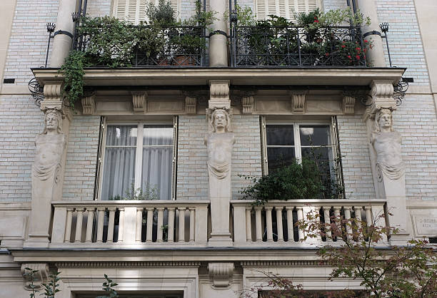 Fancy ornament details and decorations shot on Paris building facades. Doors and windows surround, decorated balconies.