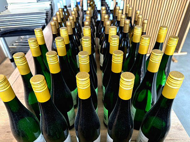 istock Bottles of white wine lined up 2218772091