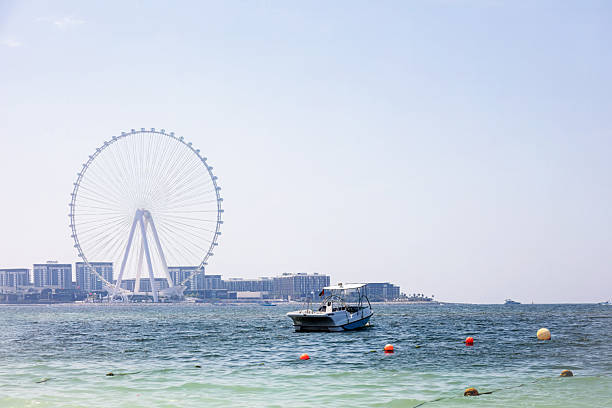 istock Dubai ocean view with boat and  ferris wheel. Unated Arab Emirates 2218772904