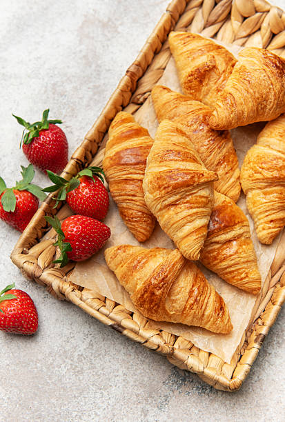 Freshly baked croissants and strawberries creating a delightful breakfast scene