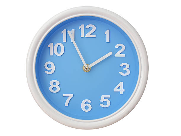 Wall clock with a blue face and white frame showing exactly 01:55 or 13:55. Represents time, deadlines.
