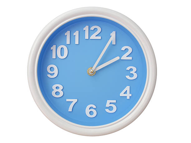 Wall clock with a blue face and white frame showing exactly 02:05 or 14:05. Represents time, deadlines.