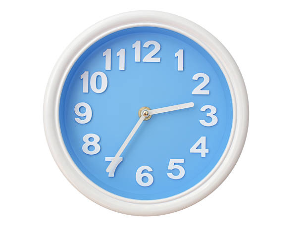 Wall clock with a blue face and white frame showing exactly 02:35 or 14:35. Represents time, deadlines.