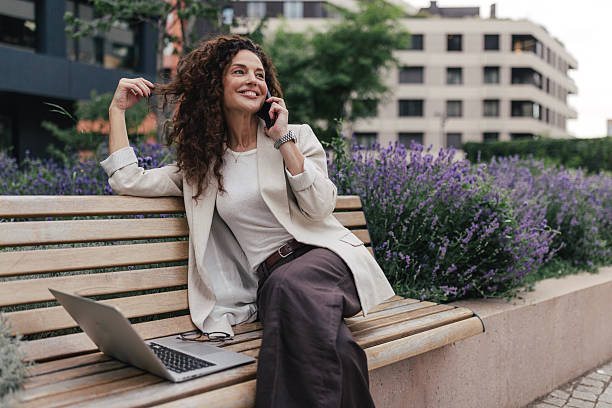 istock Woman Enjoying a Phone Conversation in Nature 2218776847