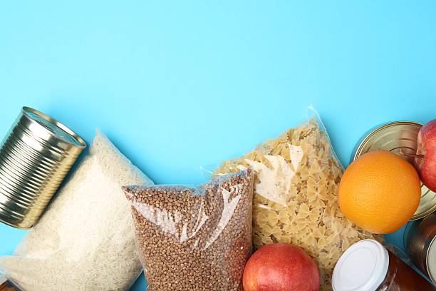 istock Food donation. Different products on light blue background, flat lay. Space for text 2218777703