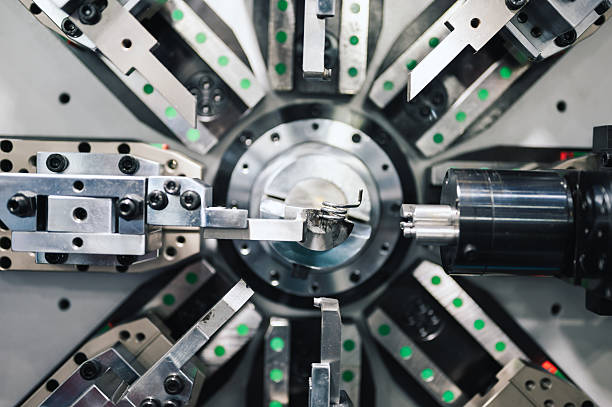 istock Robotic wecoil winding machinery used in electronics or motor manufacturing synchronized robotic arms and mechanical movement 2218779165