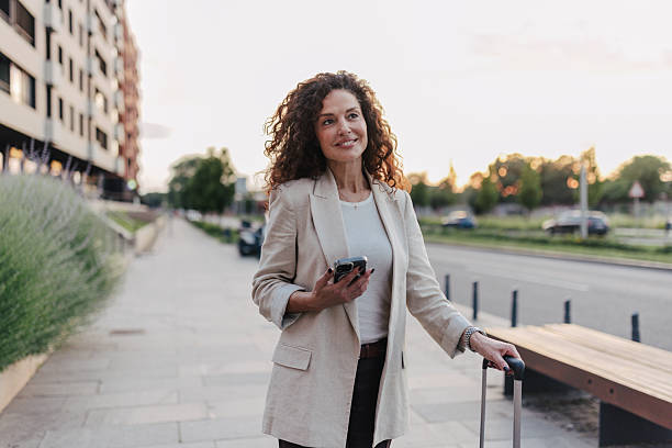 istock Charming Woman with Luggage in Modern Setting 2218779404